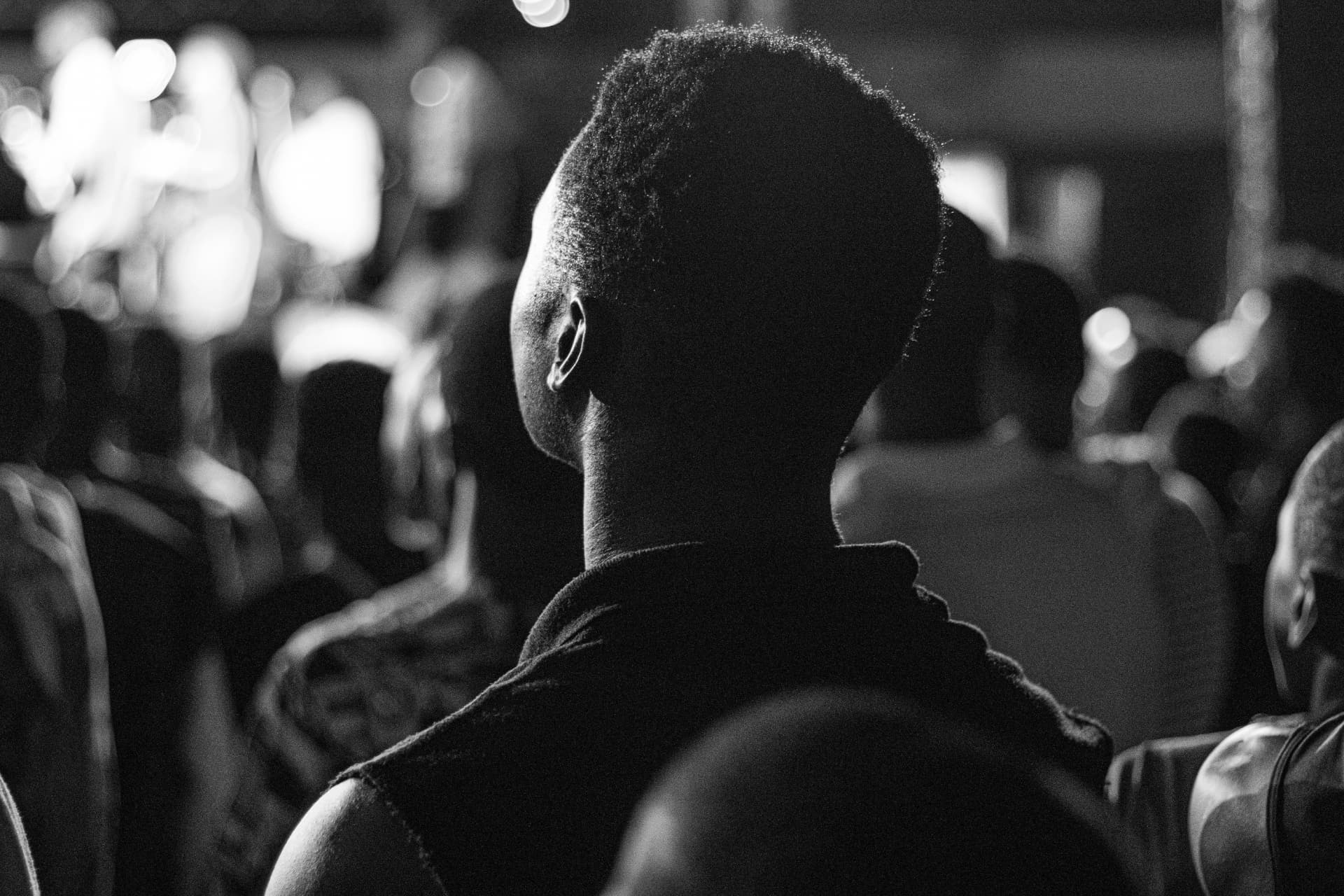 A person listening within a crowd